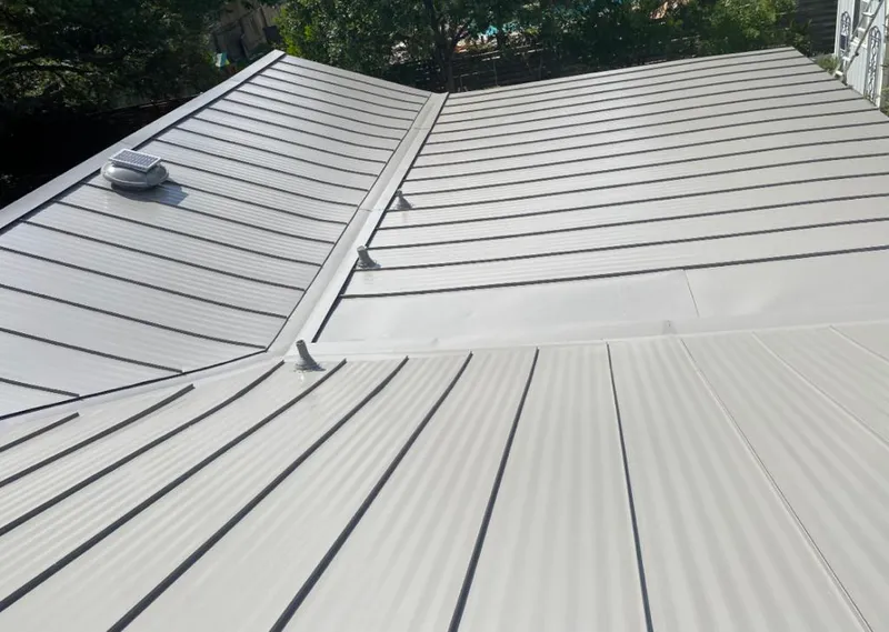 Solar attic fan installed on a metal roof for Roof Ventilation in Batesburg-Leesville