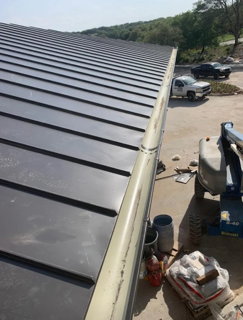 Standing seam panel and gutter detail on a metal roofing jobsite in Batesburg-Leesville